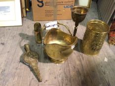 An assortment of brassware including scuttle with ceramic handles, a chalice of baluster form (
