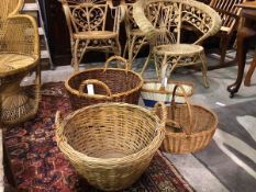 A group of five vintage wicker baskets, two with handles to sides, one formerly log basket, three