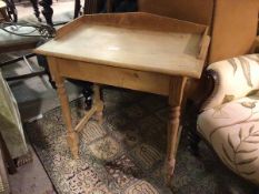 A Victorian pine washstand, with arched three quarter gallery, the rectangular top with rounded