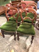 A set of six balloon back Victorian mahogany dining chairs with yoke style back rail, green