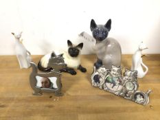 A Royal Copenhagen Siamese cat (19cm) and a Royal Doulton Reclining Siamese Cat, two other ceramic