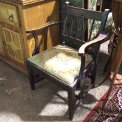 A 1920s/30s Georgian inspired armchair, with tablet top rail above banister back, with curved arms