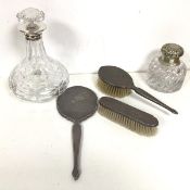 A 1956 Birmingham silver engine turned brush set, with hand mirror (28cm), clothes brush and hair