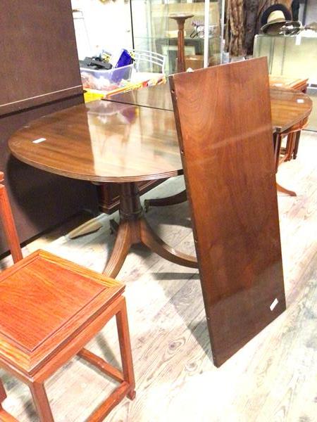 A reproduction mahogany Georgian style double pedestal dining table, with reeded edge and single