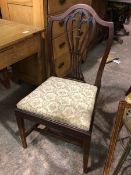 A 1920s side chair, with hump top rail above a pierced baluster splat with Prince of Wales feathers,