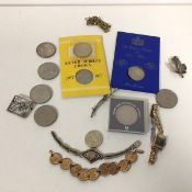 A mixed lot including a collection of Commemorative coins, a Titus lady's wristwatch, silver badges,