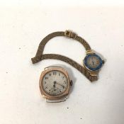 A lady's early 20thc 18ct gold wristwatch with a foliate enamelled border and arabic numerals to