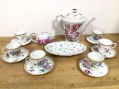 A set of six Limoges tea cups (6.5cm) with saucers, with floral and insect decoration, and a Swiss