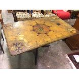 A 1920s/30s table, the top painted a faux marble with the Windsor coat of arms and other coats of