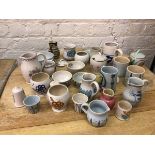 A large collection of Buchan stoneware including jugs, mugs, beakers, salt and peppers, bowls,