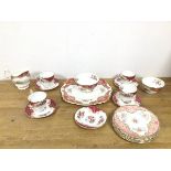 A mixed tea service of Paragon ware, with Rockingham and Honiton patterns, includes four tea cups (