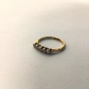 An 18ct gold ring with a row of five chip diamonds (O/P) (2.2g)