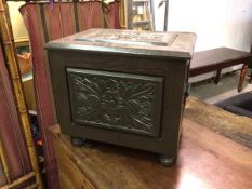 A 1920s/30s hinged box, with carved panels depicting thistles to top and front, handles to side,