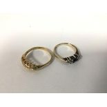 An 18ct gold ring, the navette shaped setting set five clear stones within a pierced border (R/S) (