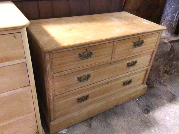 An Edwardian ash chest of drawers, fitted two short drawers and two long drawers, the drop handles