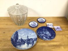 A mixed lot including a glass biscuit barrel (25cm), two German decorative wall plates, two