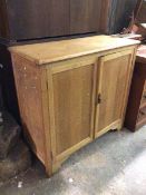 A side cabinet, first half of the 20thc., the rectangular top with moulded edge above two cupboard