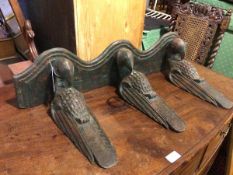 A modern painted rustic style wall bracket with undulating moulded edge, with three bird supports (