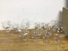 A collection of glassware including two large brandy glasses (19cm), four etched glass champagne