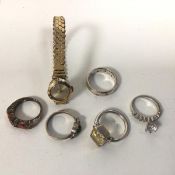 A collection of white metal and silver rings, all with various designs and settings and an
