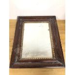 A 1920s wall mirror, the rectangular plate within a gilt inner frame and an outer moulded frame (