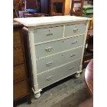 A late 19thc/early 20thc chest of drawers, painted finish, the inverted breakfront top above two