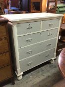 A late 19thc/early 20thc chest of drawers, painted finish, the inverted breakfront top above two