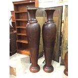 A pair of monumental hardwood baluster shaped vases (a/f) (162cm) (2)
