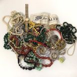 A quantity of costume jewellery including necklaces, brooches, lady's wristwatch, paste pearls