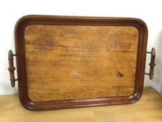 A mid 20thc drinks tray with raised turned handles (48cm x 32cm)