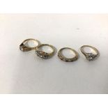 A group of four rings, including a 9ct solitaire CZ set ring (K), a 9ct gold CZ cluster ring, a