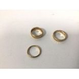 Three 9ct gold wedding bands (largest: M) (combined: 7.14g)