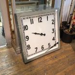 A large decorative wall clock within a painted frame, minute hand (a/f) (77cm x 76cm)