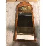 An early 20thc pier mirror, with moulded surmount above a painted panel with still life (88cm x