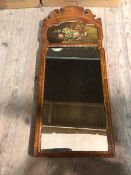 An early 20thc pier mirror, with moulded surmount above a painted panel with still life (88cm x