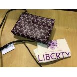 A Liberty of London two section crossbody handbag, the two sections with zipper closure in signature