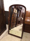 An Edwardian mahogany wall mirror, with dome top frame, formerly a cheval mirror, with later