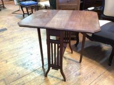 An Edwardian mahogany Sutherland table, the rectangular top with canted corners and moulded edge