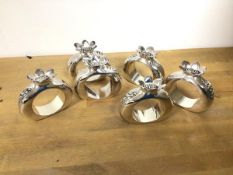A set of six Silea napkin rings in the form of pomegranates (6cm x 6.5cm x 2.5cm)