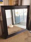 A large wall mirror, with bevelled square glass within reeded frame (150cm x 150cm)