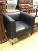 A Walter Knoll tub armchair in black leather on straight tapering supports (69cm x 78cm x 76cm)