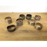 A group of napkin rings including three silver napkin rings (combined: 74g), five other napkin rings