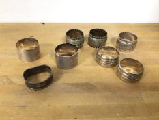 A group of napkin rings including three silver napkin rings (combined: 74g), five other napkin rings