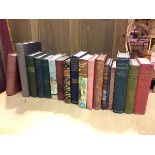 A collection of books including The Complete Farmer by Primrose McConnell, Andersen's Fairy Tales,