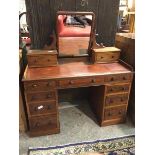 A Victorian mahogany dressing table, with hinged mirror supported by two jewellery drawers, the