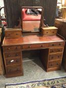 A Victorian mahogany dressing table, with hinged mirror supported by two jewellery drawers, the