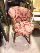 An Edwardian corner chair, with hoop back, in floral upholstery, on splay supports united by X