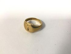 An 18ct gold signet style ring engraved with a bird perched upon dagger (E) (4.25g)