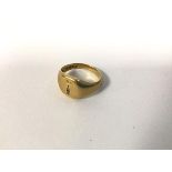 An 18ct gold signet style ring engraved with a bird perched upon dagger (E) (4.25g)