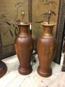 A pair of large hardwood turned table lamps, of baluster form (73cm to top of lampholder)